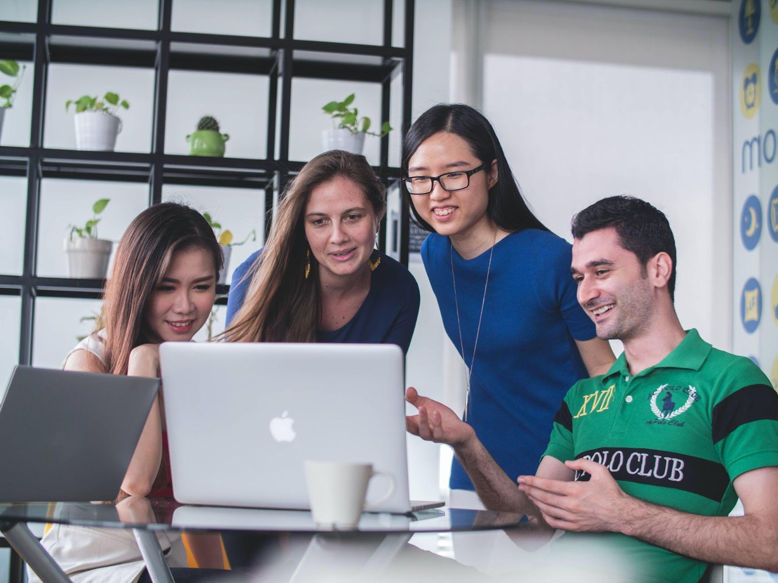 a team of nonprofit employees working together on a laptop