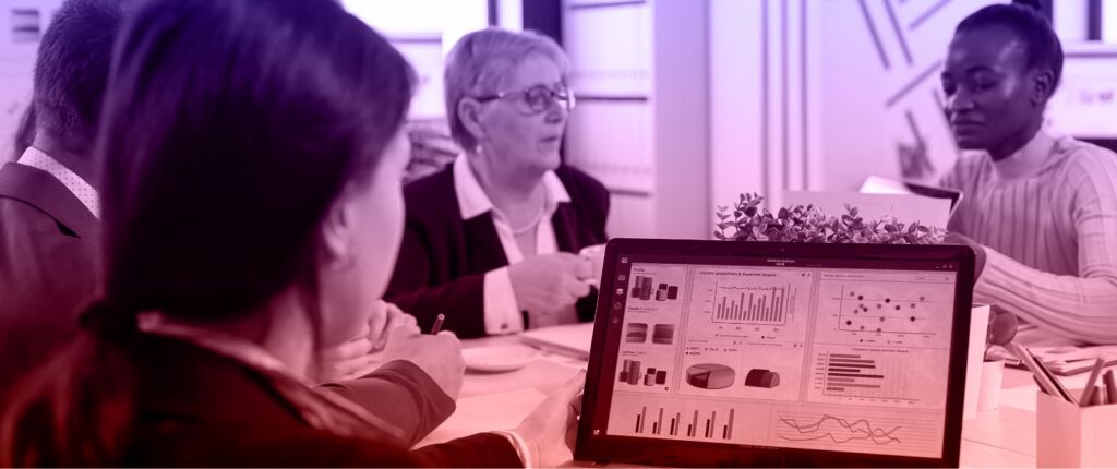 Nonprofit professionals using predictive analytics to anticipate needs and improve community impact.
