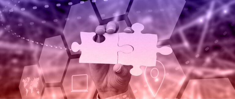 A person holds a puzzle piece, symbolizing the search for truth amidst a blurred background.